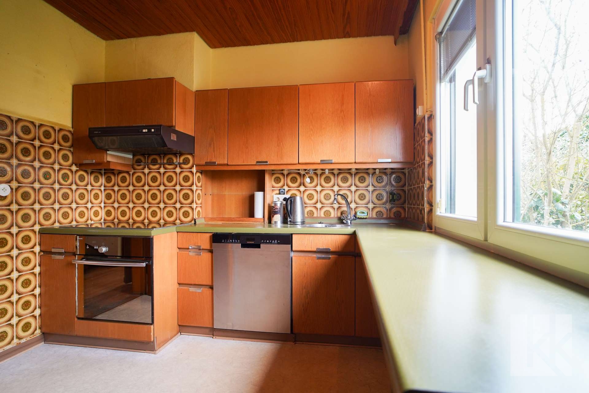 Küche im eigenen Raum mit...